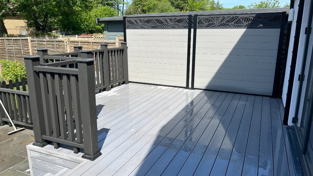Composite deck with privacy screen and laser cut panels Godalming Surrey