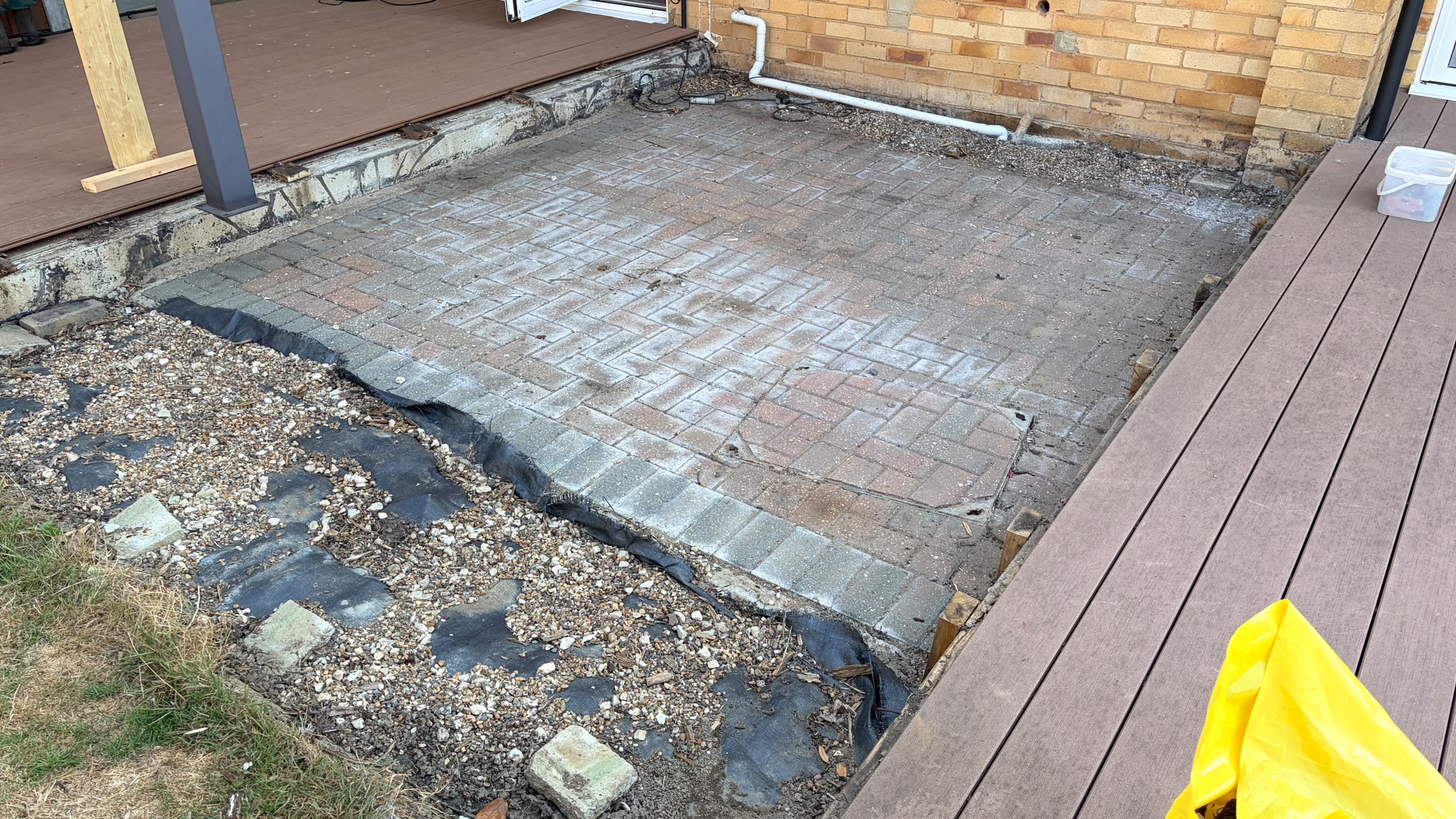 Old decking frame stripped back to patio in East Grinstead